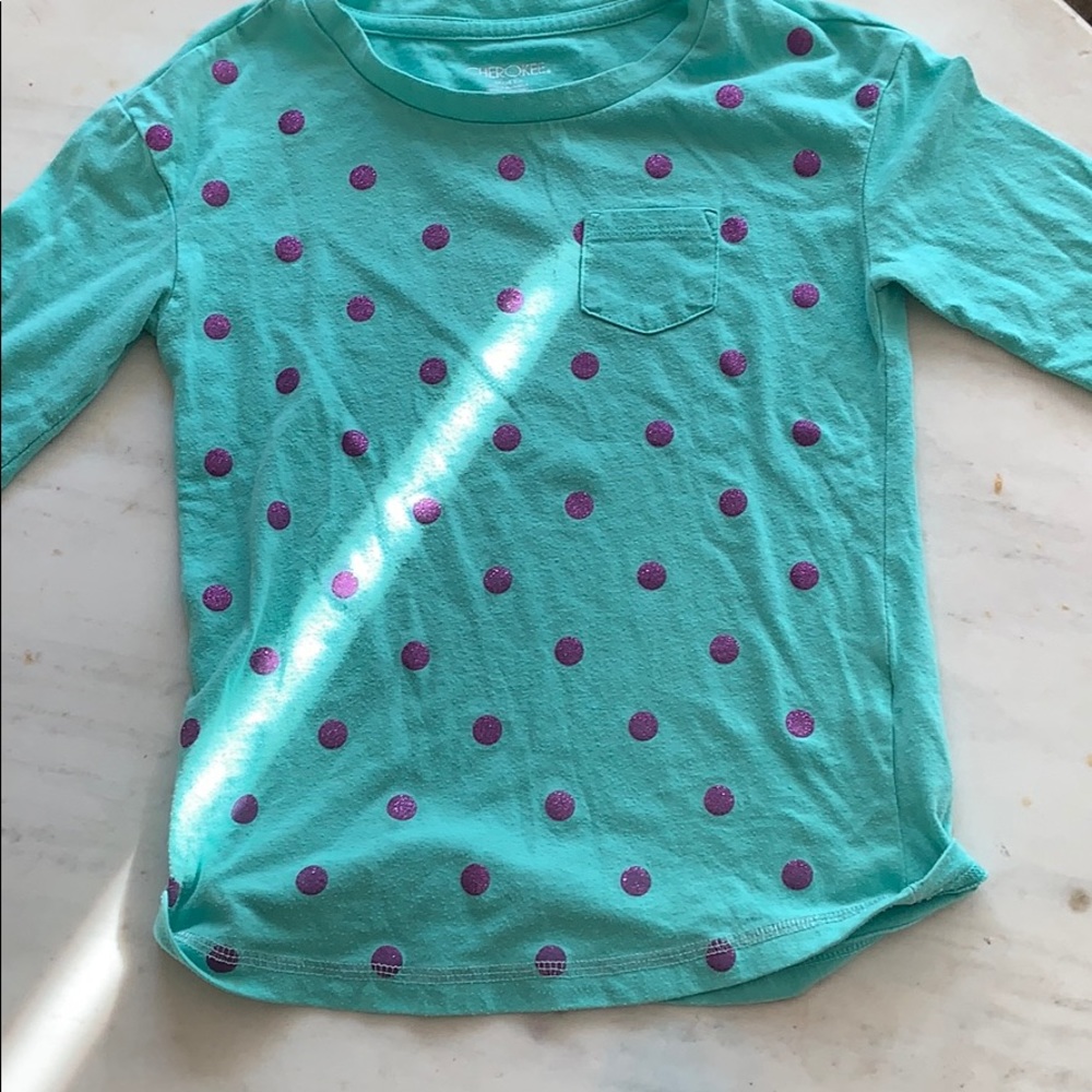 Turquoise with purple polkadots on it